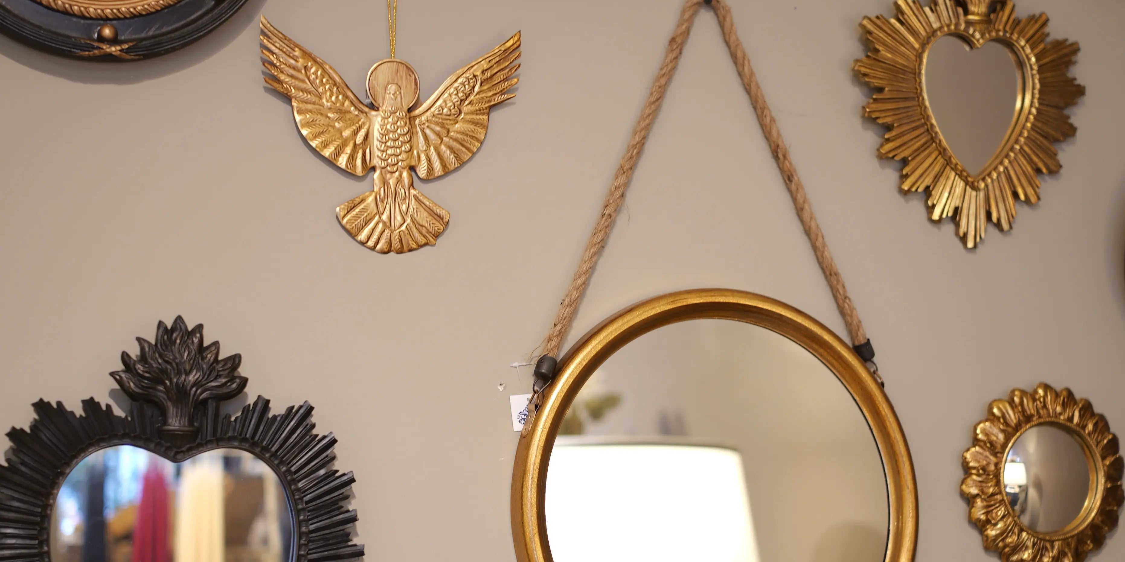 Collection of decorative mirrors on a wall