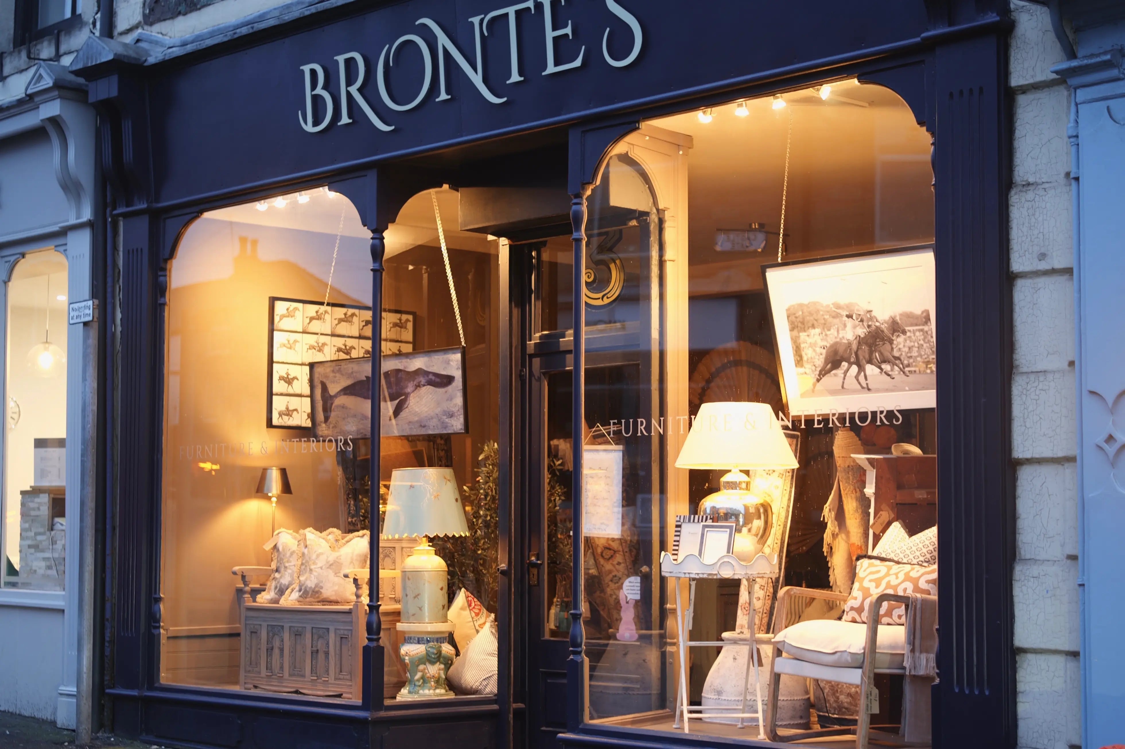 Storefront of a furniture store named 'Brontés' with interior decor displayed in the window.