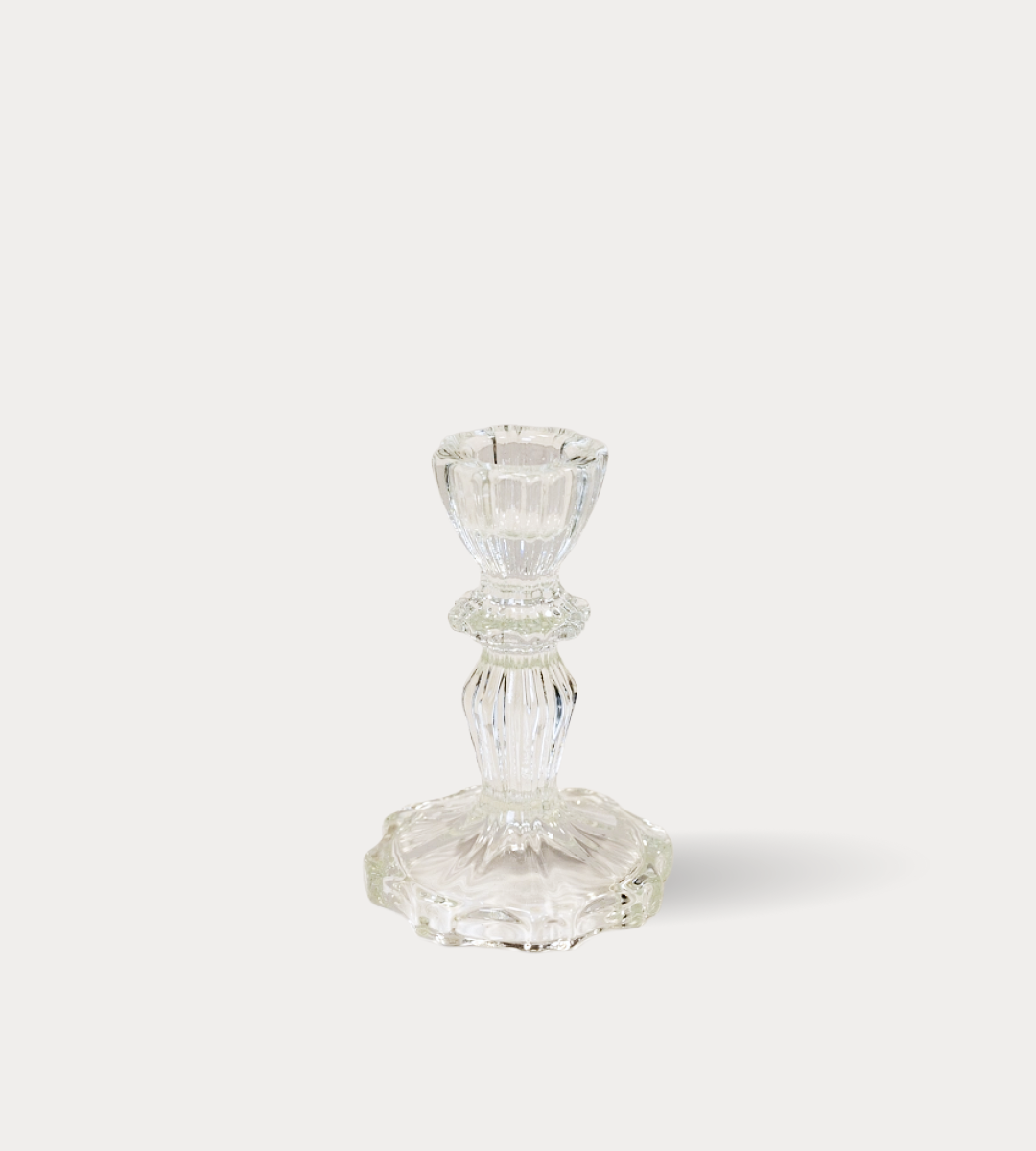 Clear glass candle holder on a white background