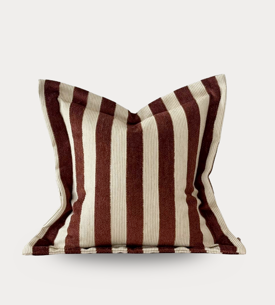 Striped pillow with brown and beige pattern on a white background
