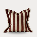 Striped pillow with brown and beige pattern on a white background