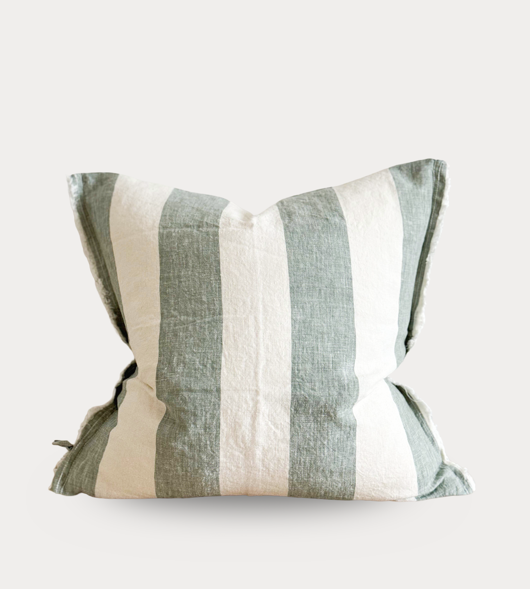 Striped pillow with green and beige pattern on a white background