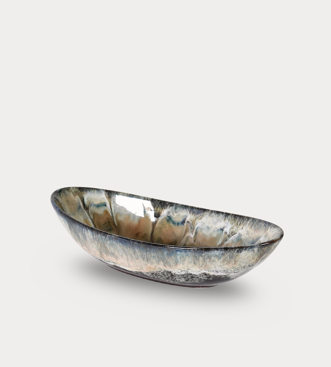 Decorative bowl with a metallic finish on a light gray background