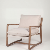 Chair with wooden frame and beige cushions on a white background