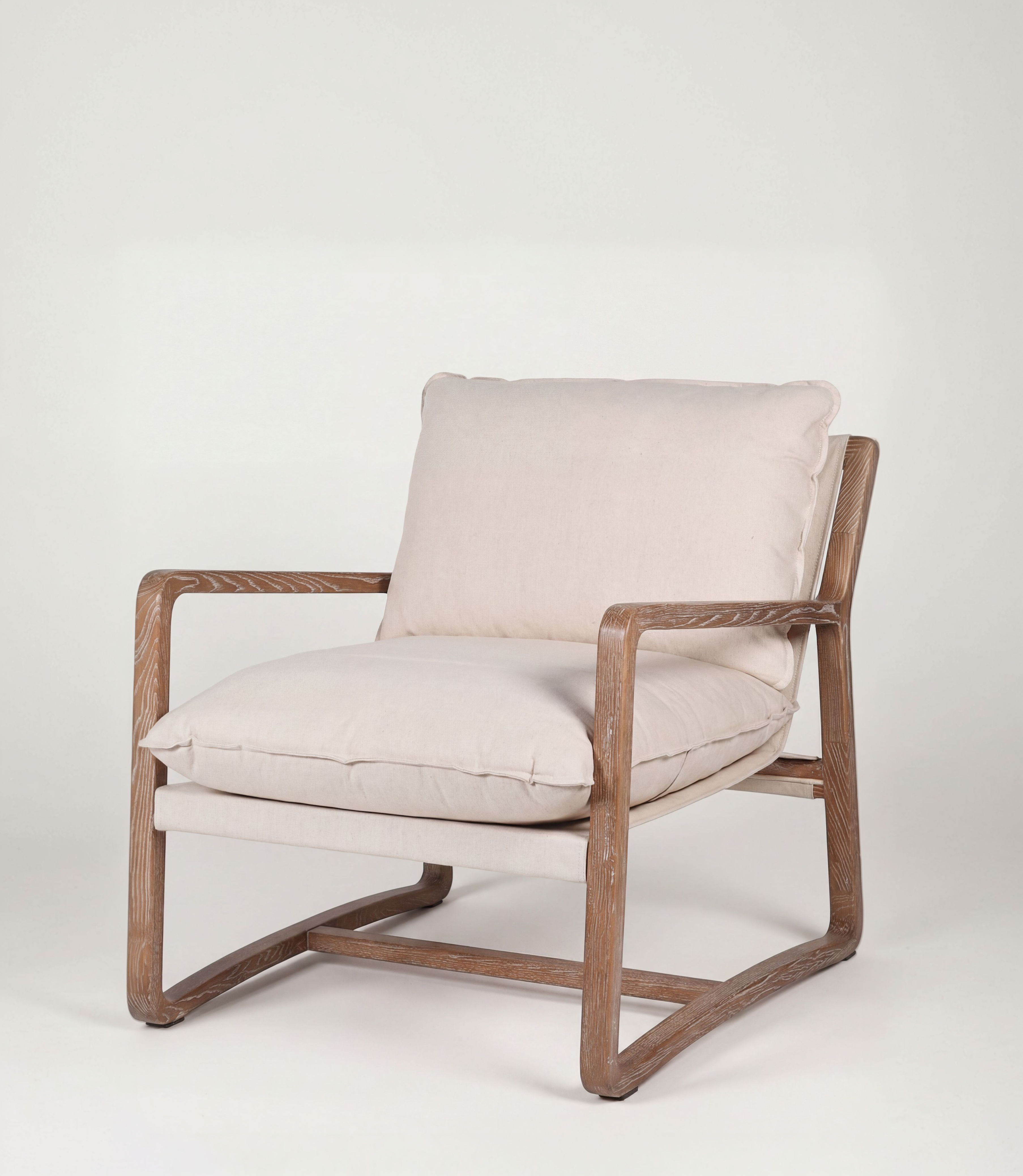 Chair with wooden frame and beige cushions on a white background