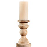 Wooden candle holder with a beige candle on a white background