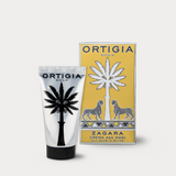 Ortigia hand cream with packaging featuring palm tree design on a white background