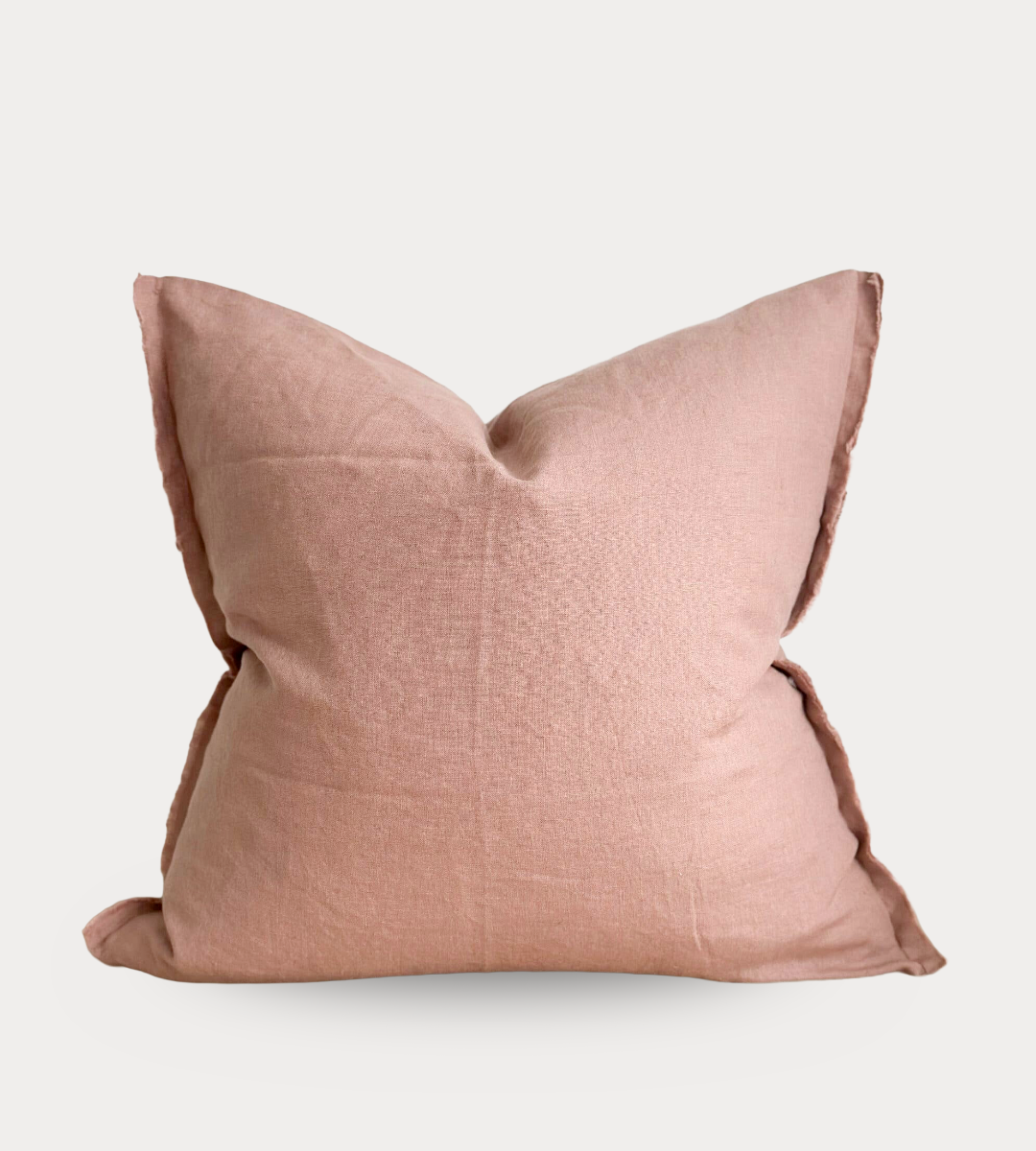 Pink pillow on a light gray background