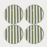 Four green and white striped plates on a light gray background