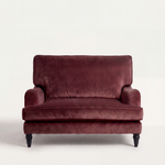 Maroon velvet sofa on a white background