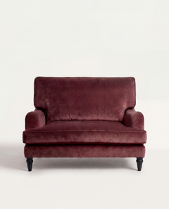 Maroon velvet sofa on a white background
