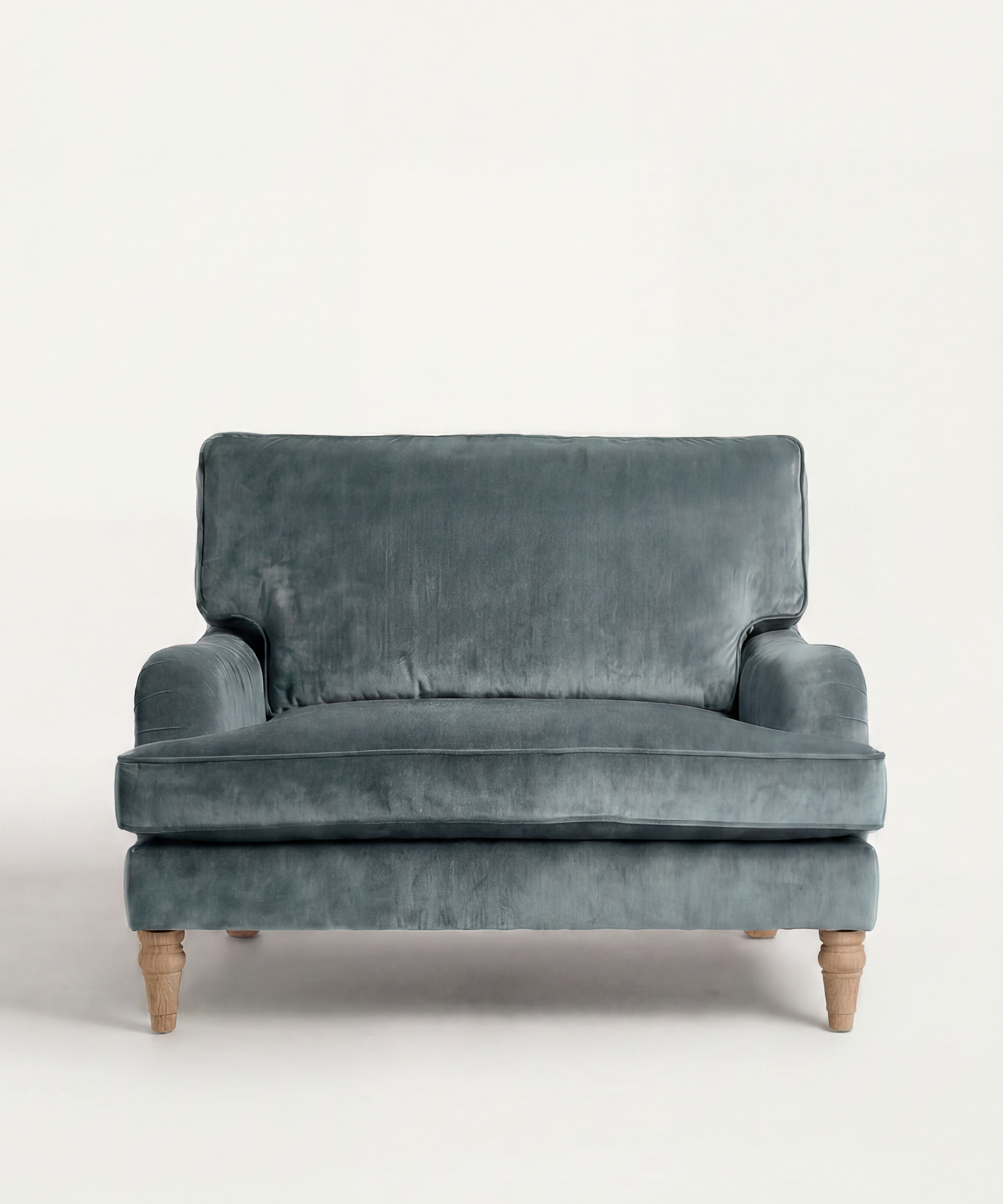 Blue velvet sofa on a white background