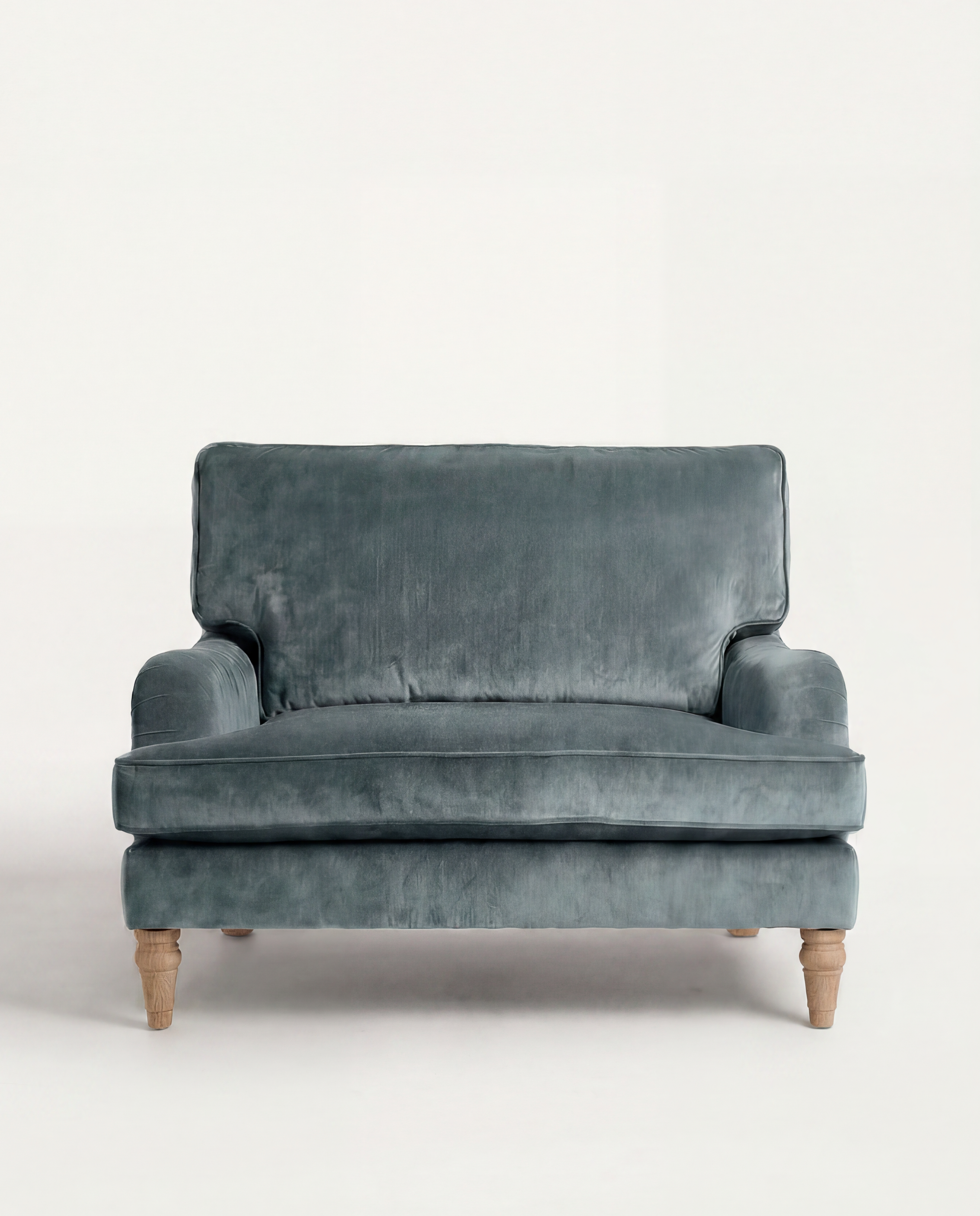 Blue velvet sofa on a white background
