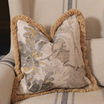 Decorative pillow with floral pattern on a striped sofa